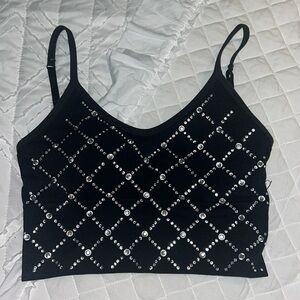 Black tank top with rhinestones all over it very cute size medium large